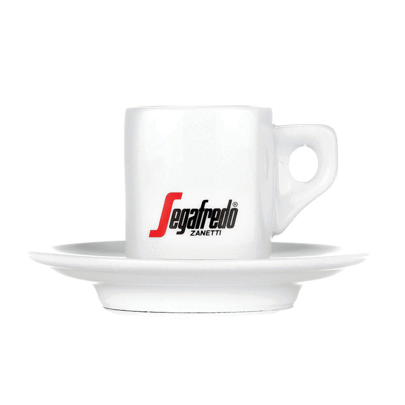 The Segafredo Cup & Saucer Set by Segafredo Zanetti features a ceramic espresso cup with the brand's logo and a matching white saucer, offering a classic set for your coffee experience.
