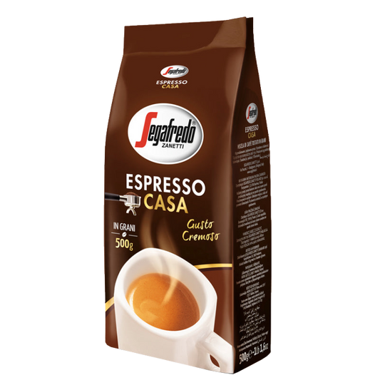 The Segafredo Zanetti® Coffee Espresso Casa Whole Bean, in a brown and white 500g bag, combines Arabica and Robusta for a rich flavor. The packaging displays a coffee cup with creamy espresso, emphasizing its medium roast profile.