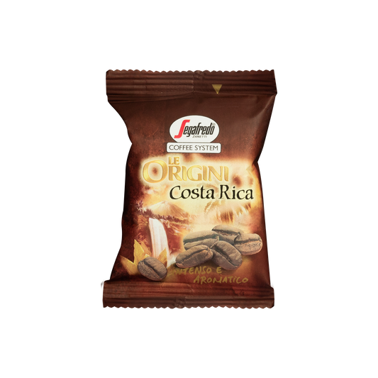 Small brown packet labeled "Segafredo Zanetti® Coffee: Costa Rica Single Origin Espresso Single-Serve Cartridges—Intenso e Aromatico" with a tropical coffee bean image. The package design features a sunrise and coffee beans background, showcasing the rich flavors from the Segafredo Zanetti plantation in Costa Rica.