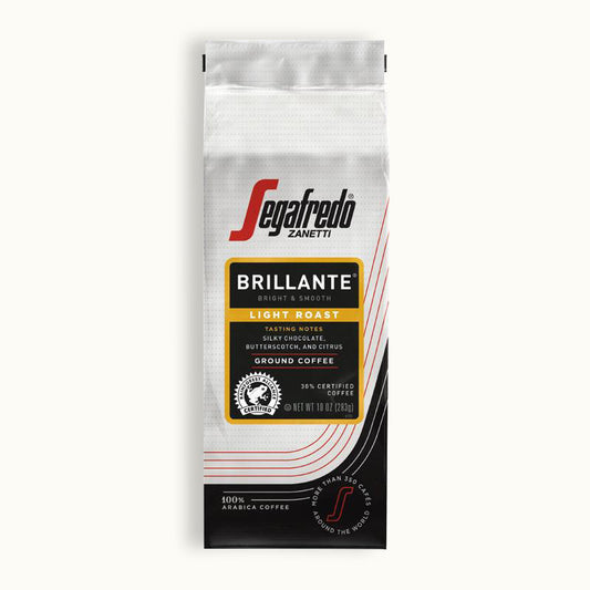 A bag of Segafredo Zanetti® Coffee Brillante Light Roast Ground Coffee with a medium body and tasting notes of silky chocolate, butterscotch, and citrus. Made from 100% Colombian and Sumatran Arabicas, the bag contains 12 oz (340g) of pure delight.