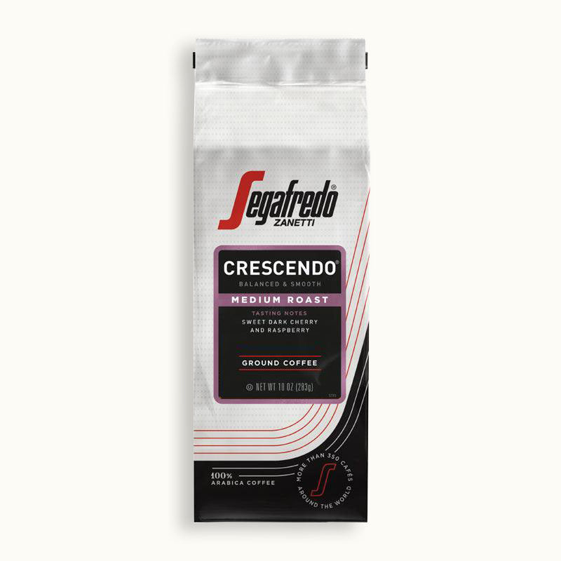 A bag of Segafredo Zanetti® Coffee Crescendo Medium Roast Ground Coffee with tasting notes of sweet black cherry, raspberry, and earthy undertones, weighing 10 oz (283g).