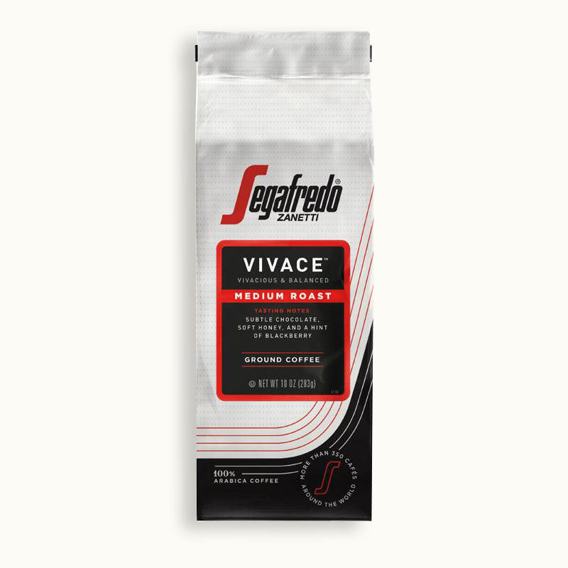 A 12 oz bag of Segafredo Zanetti® Coffee Vivace Medium Roast Ground Coffee, a Latin American blend with tasting notes of lemon, orange, blackberry, and soft caramel. The bag is white and black with red and gray accents.