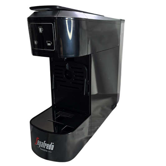 The Segafredo Zanetti® Sky Extra Espresso Capsule Machine is a black single-serve coffee maker with two drink selection buttons, a drip tray, and a compartment for Segafredo capsules.